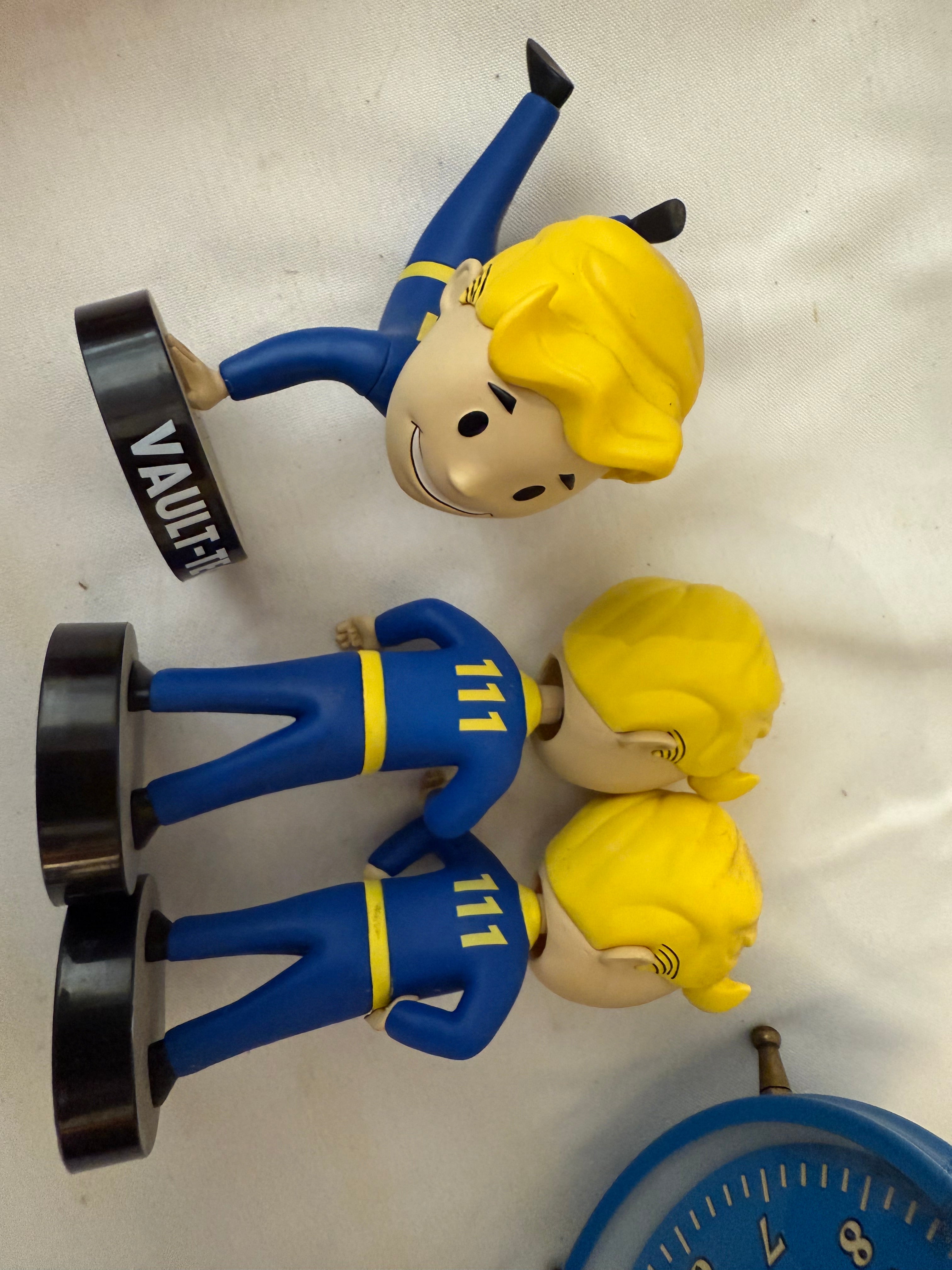Fallout Cookbook, Nuka Cola checkers, Fallout alarm clock and 3 Vault Tec bobble heads
