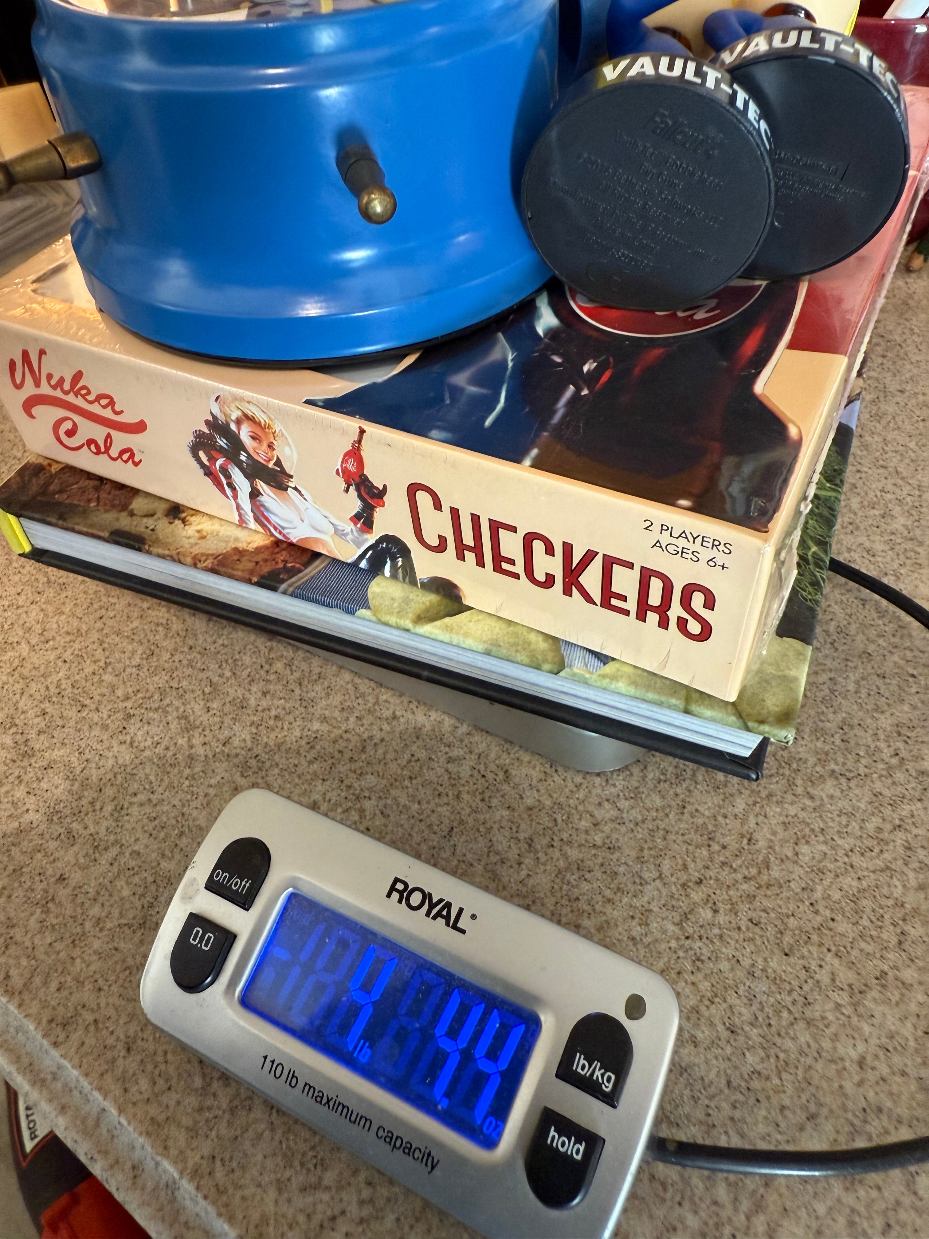 Fallout Cookbook, Nuka Cola checkers, Fallout alarm clock and 3 Vault Tec bobble heads