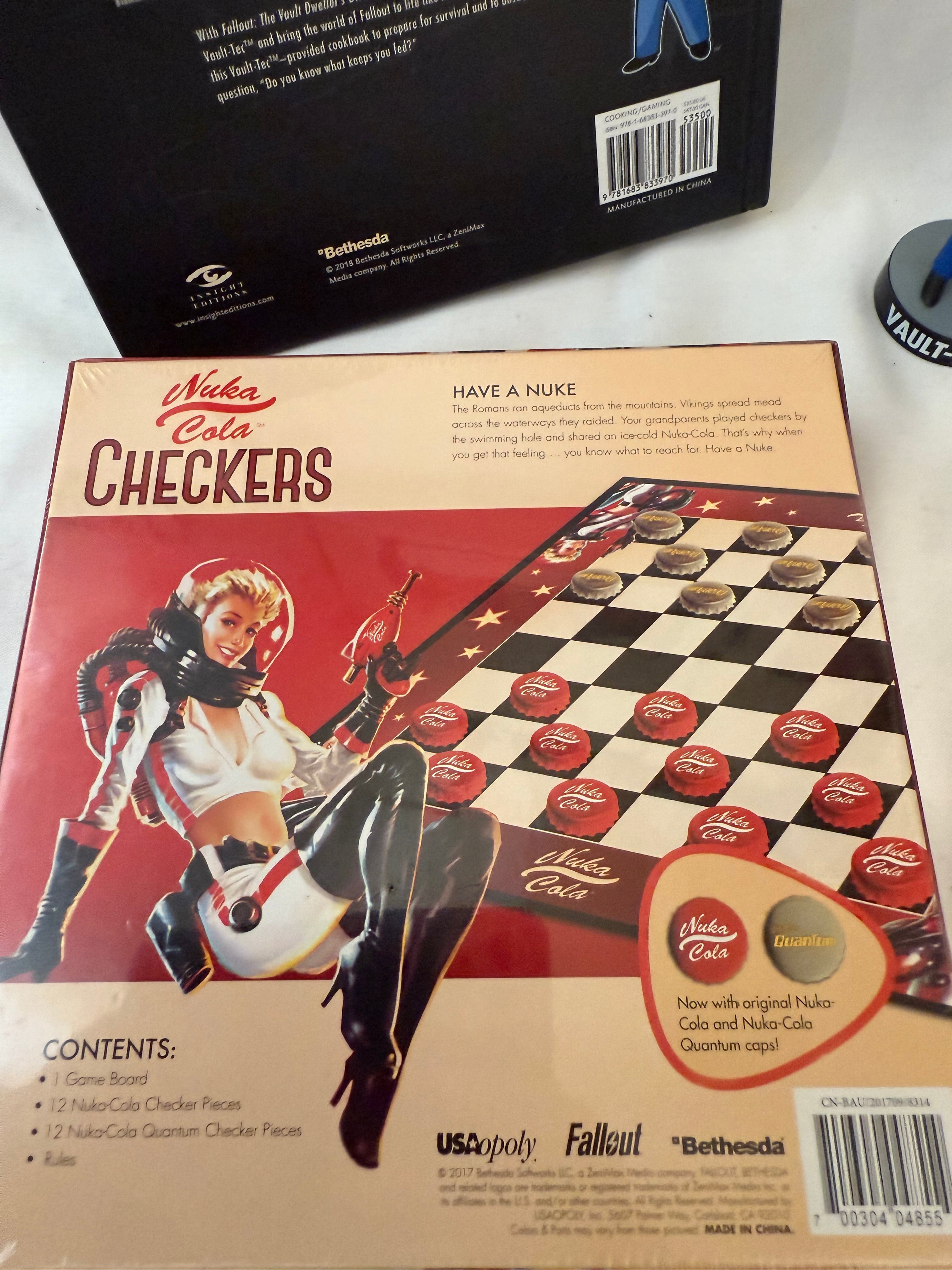 Fallout Cookbook, Nuka Cola checkers, Fallout alarm clock and 3 Vault Tec bobble heads