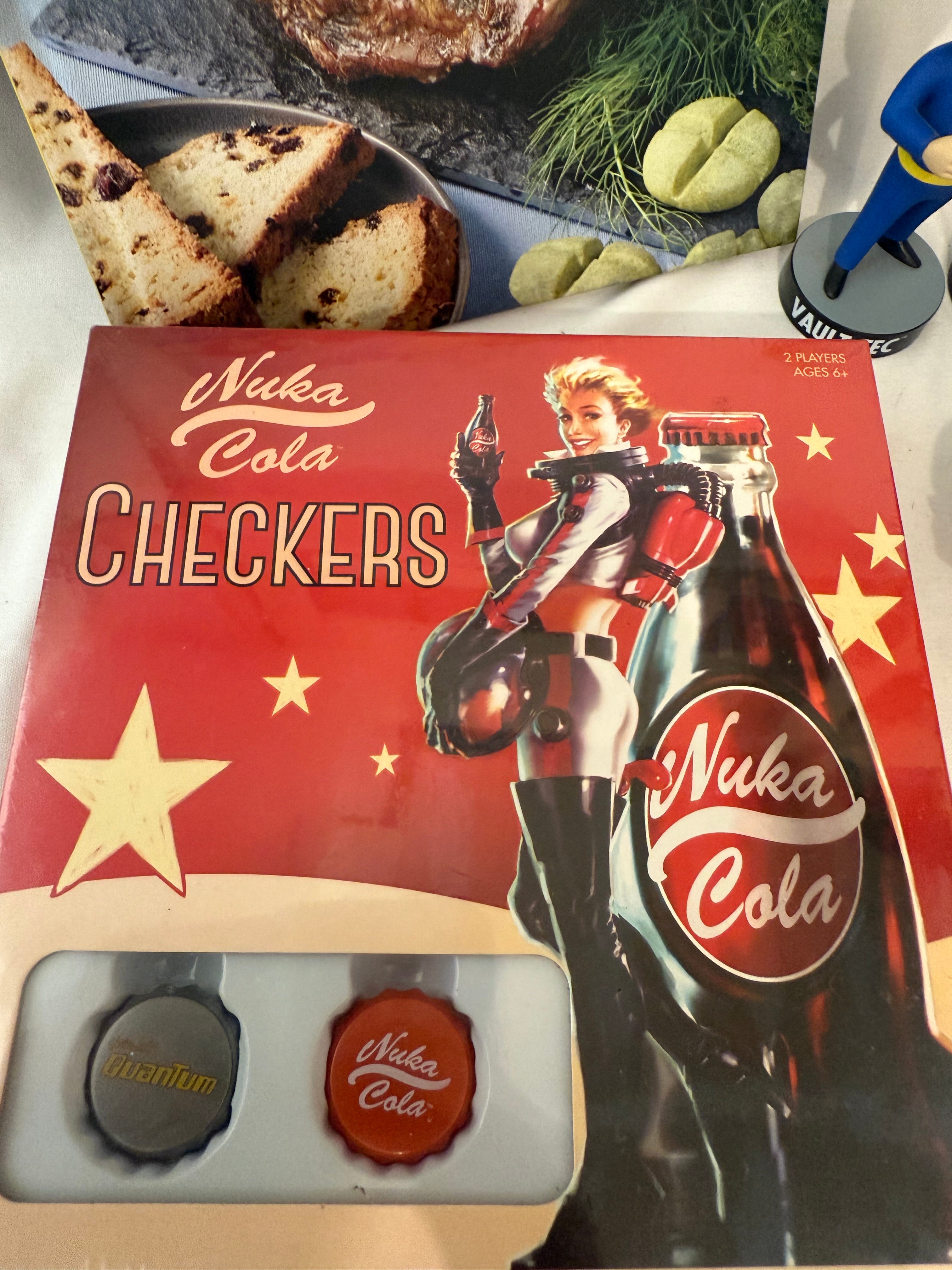 Fallout Cookbook, Nuka Cola checkers, Fallout alarm clock and 3 Vault Tec bobble heads