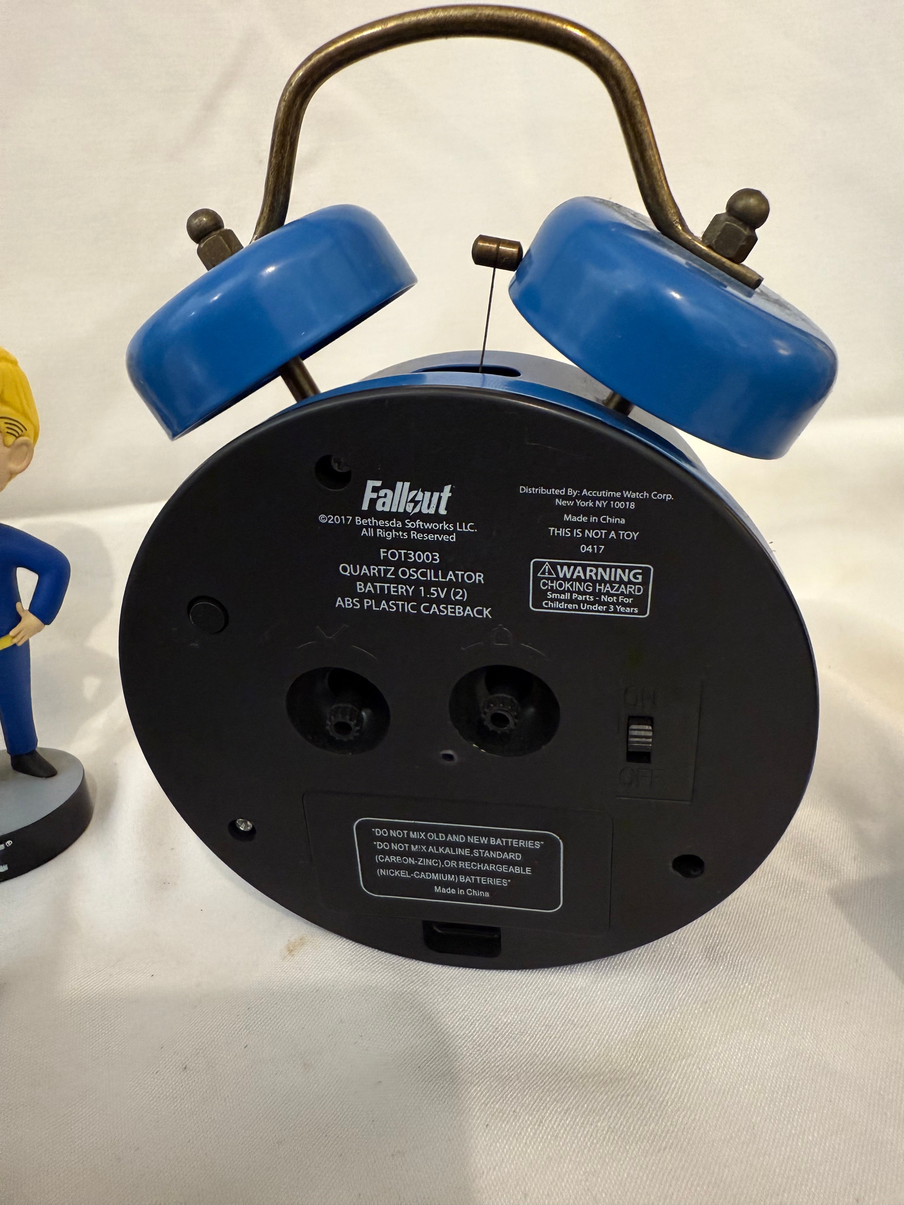 Fallout Cookbook, Nuka Cola checkers, Fallout alarm clock and 3 Vault Tec bobble heads