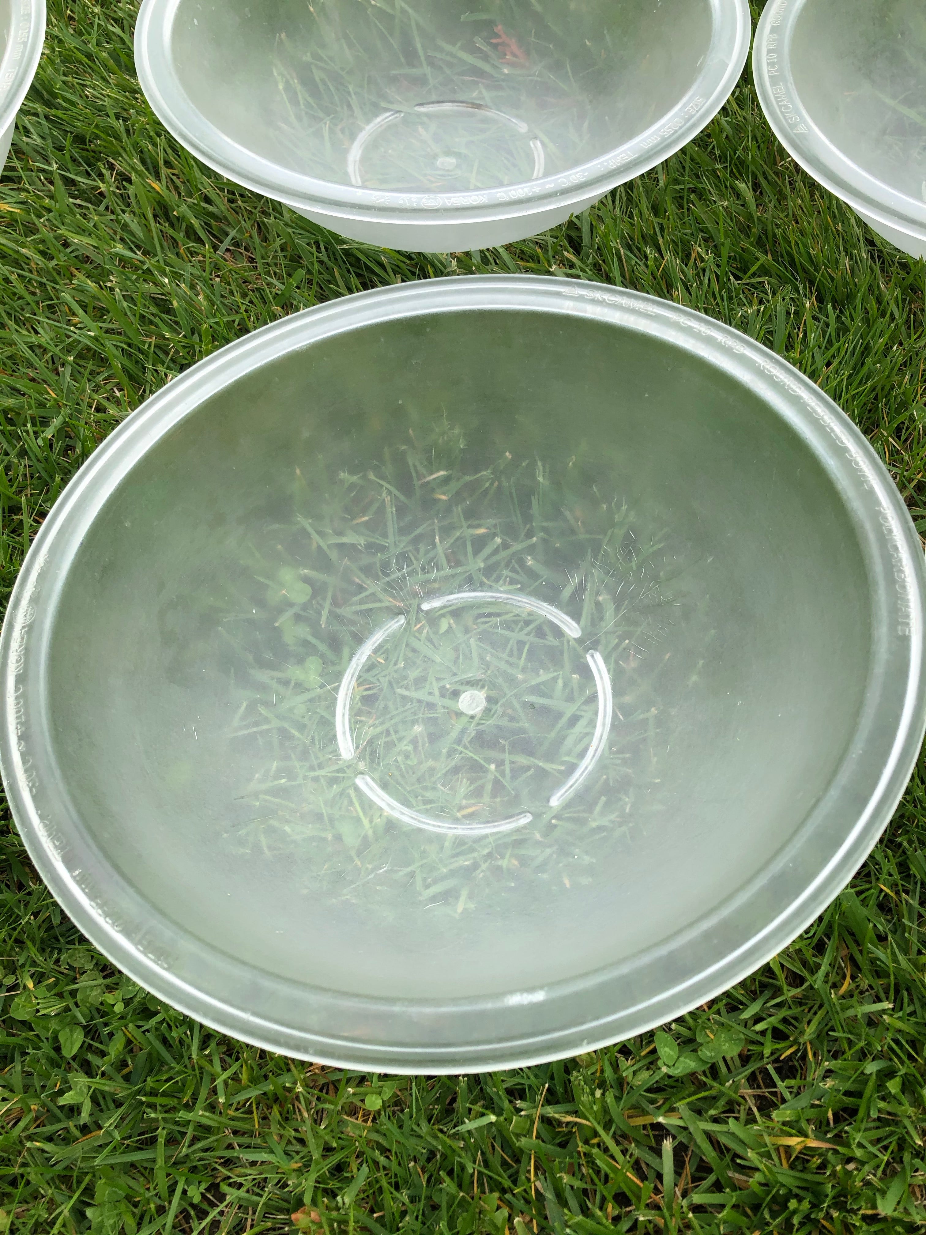 9 plastic salad bowls, appx 11 inches