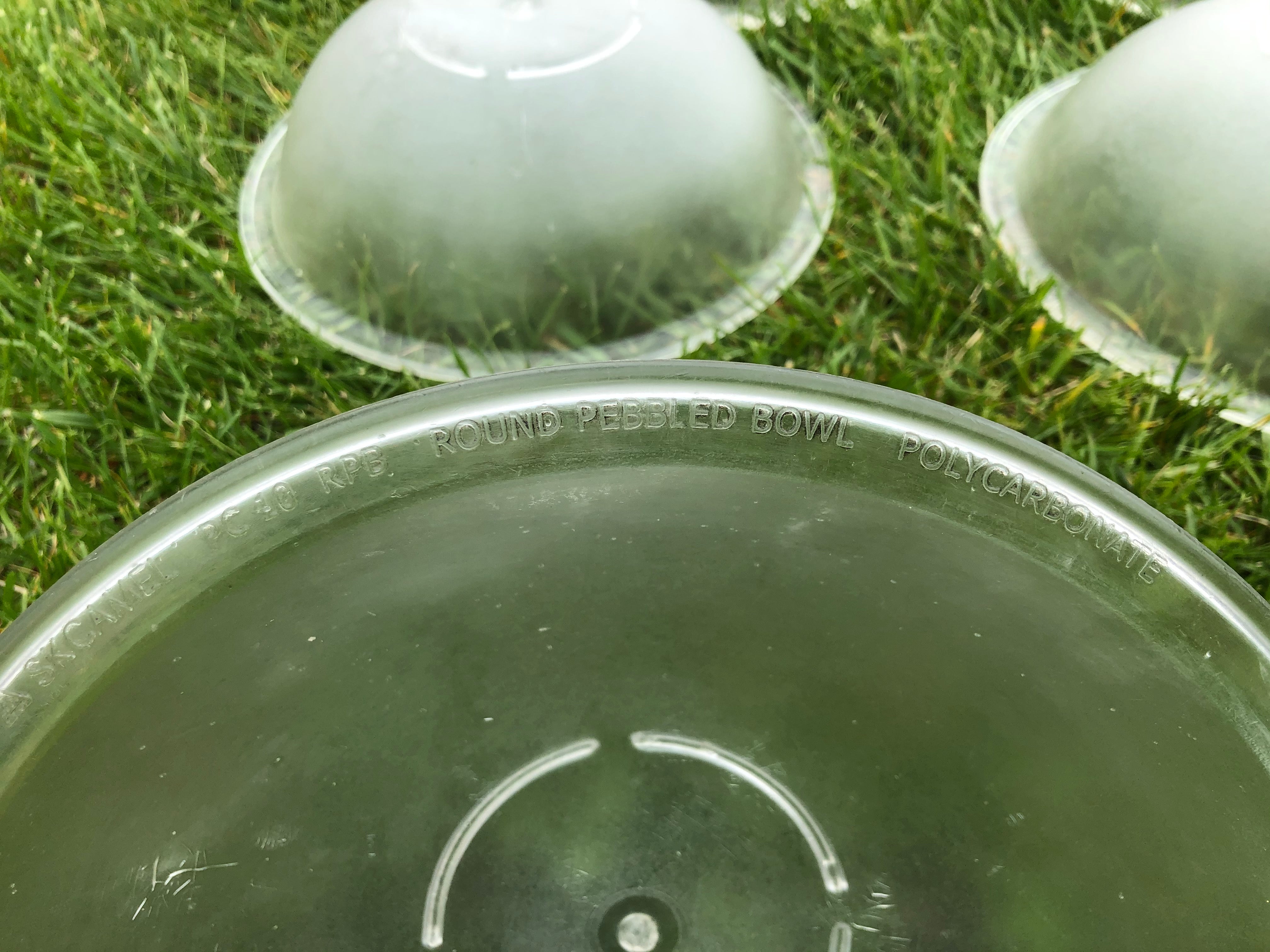 9 plastic salad bowls, appx 11 inches