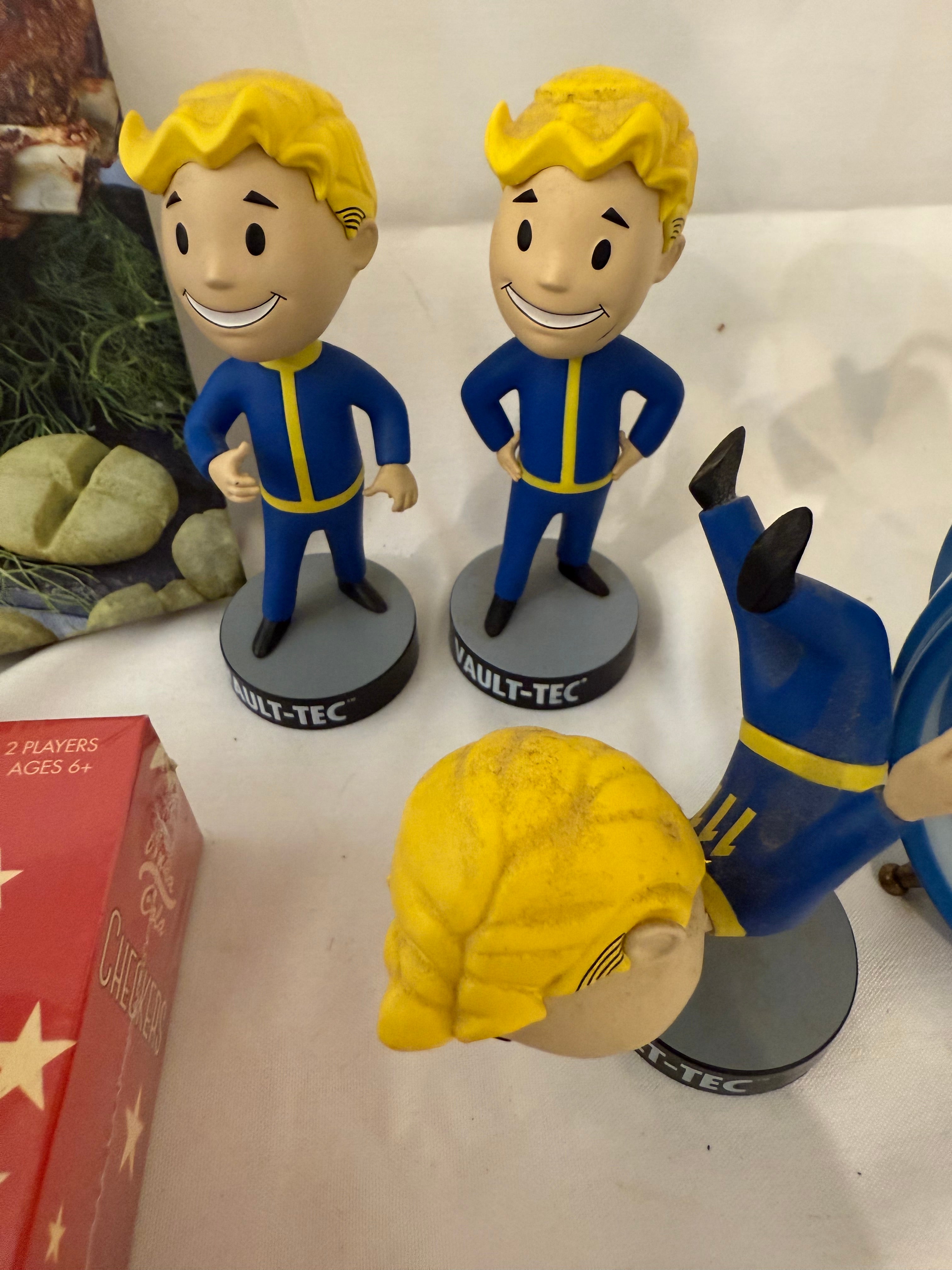 Fallout Cookbook, Nuka Cola checkers, Fallout alarm clock and 3 Vault Tec bobble heads