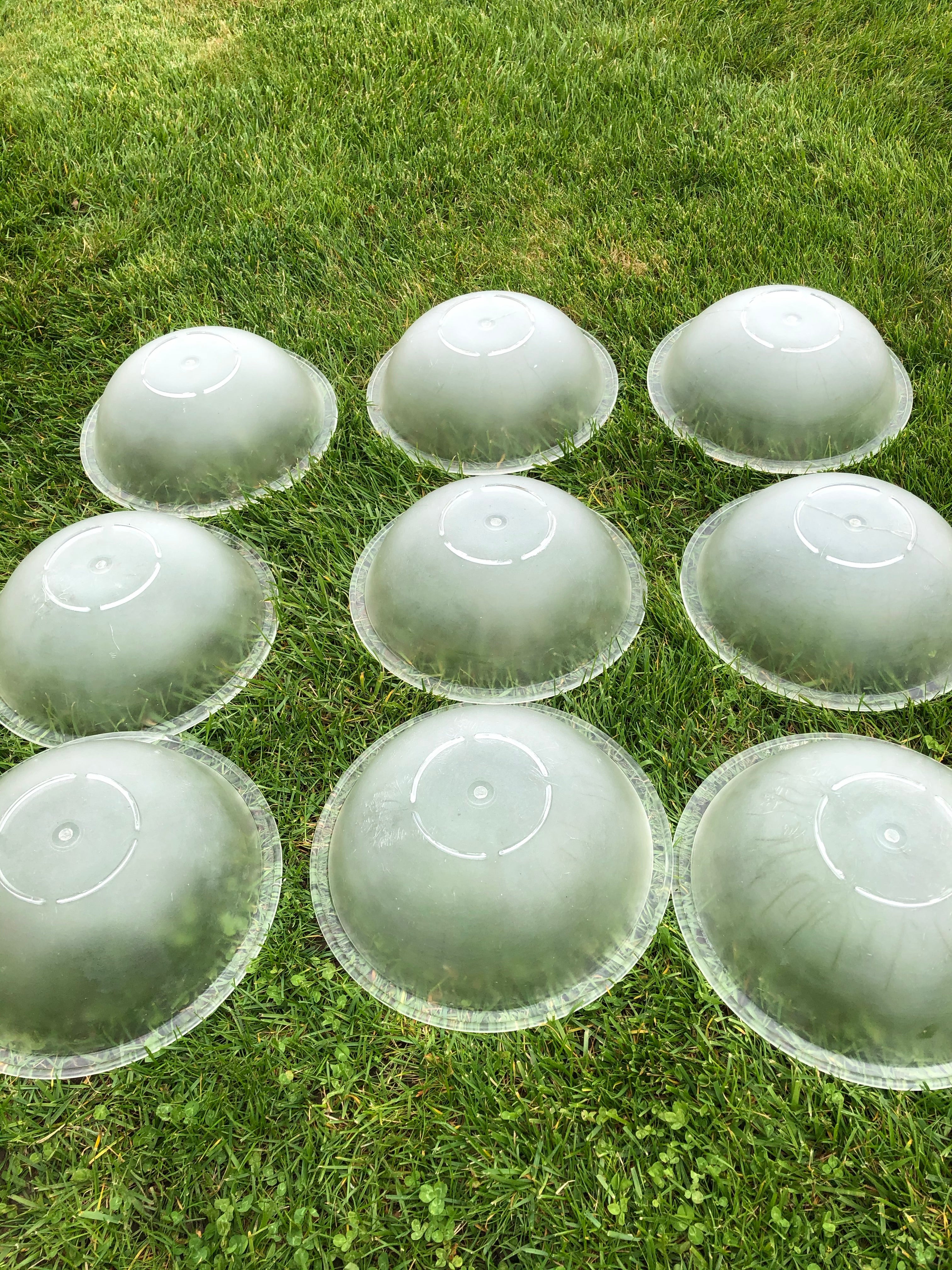 9 plastic salad bowls, appx 11 inches